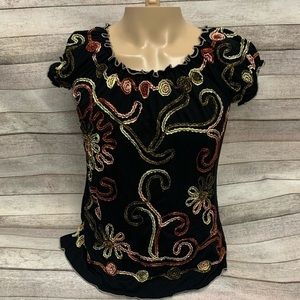 Black blouse with ric rac embroidered design, no tags.